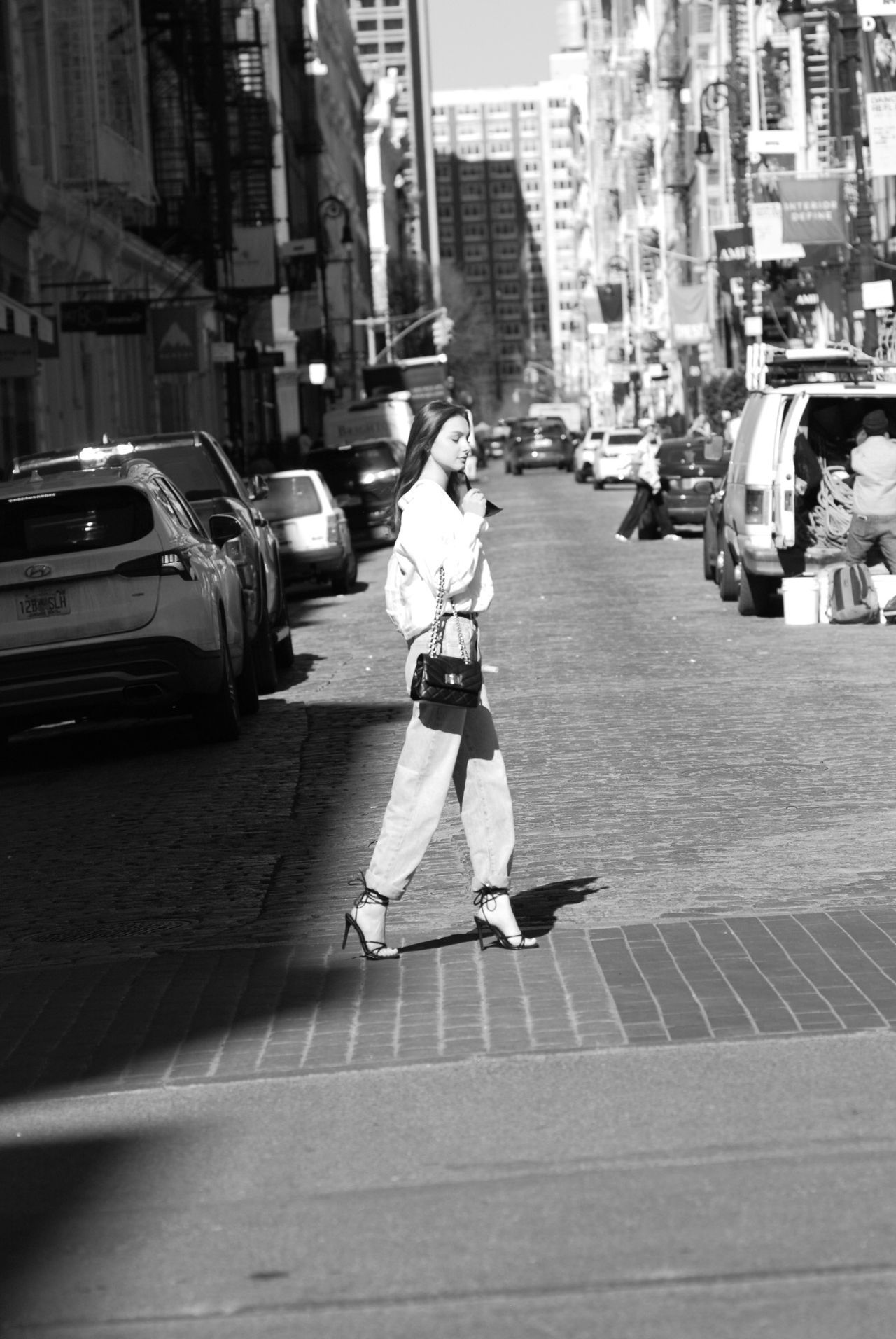 Mia Fantalin walking in Soho, New York, black and white